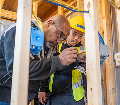 Electrician student with instructor at Summit Academy