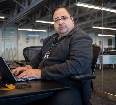 Summit alum, Hristo, working at Atomic Date