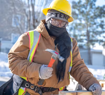 Carpentry student working outside in the winter at Summit Academy