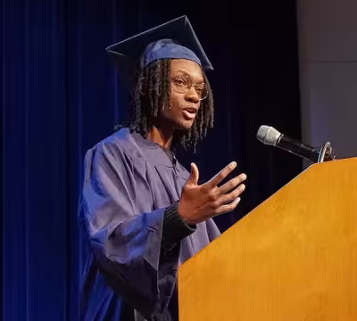 Mataly, Summit Financial Services graduate, speaking at graduation