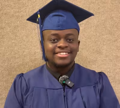 photo of Isaiah, Summit IT graduate in cap and gown