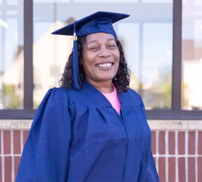 Summit Academy Alum Robyn B. in cap and gown