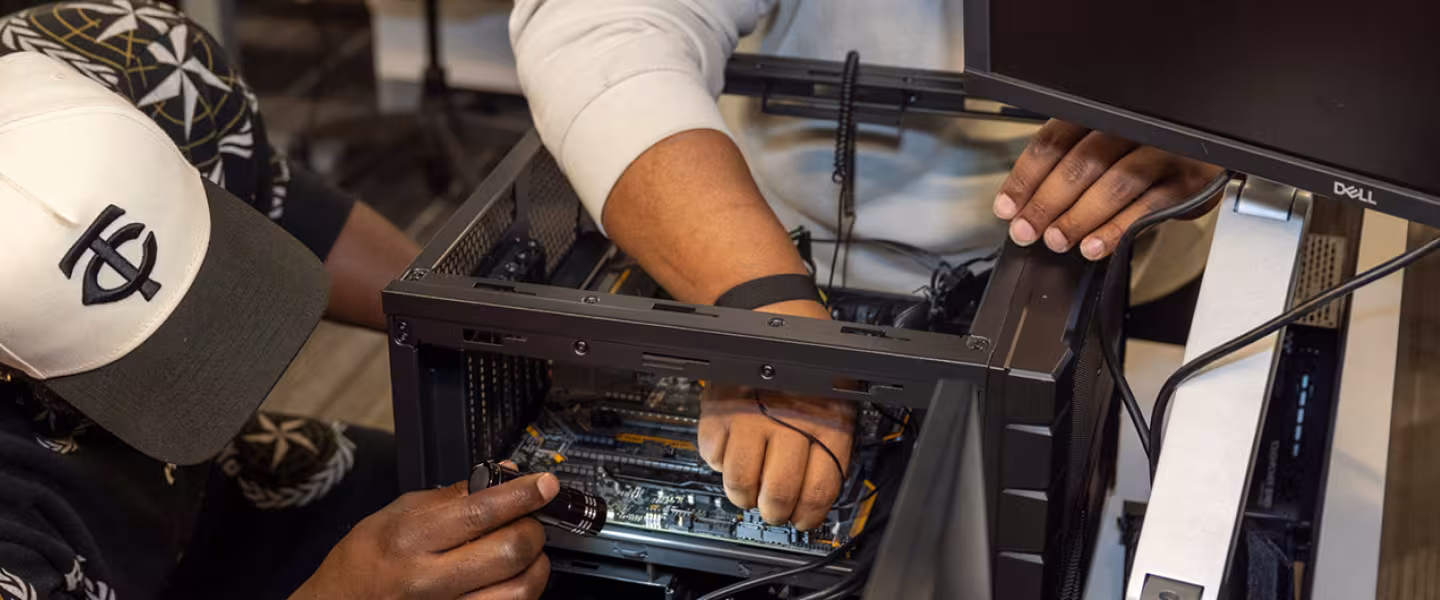 IT students learning hands on in classroom