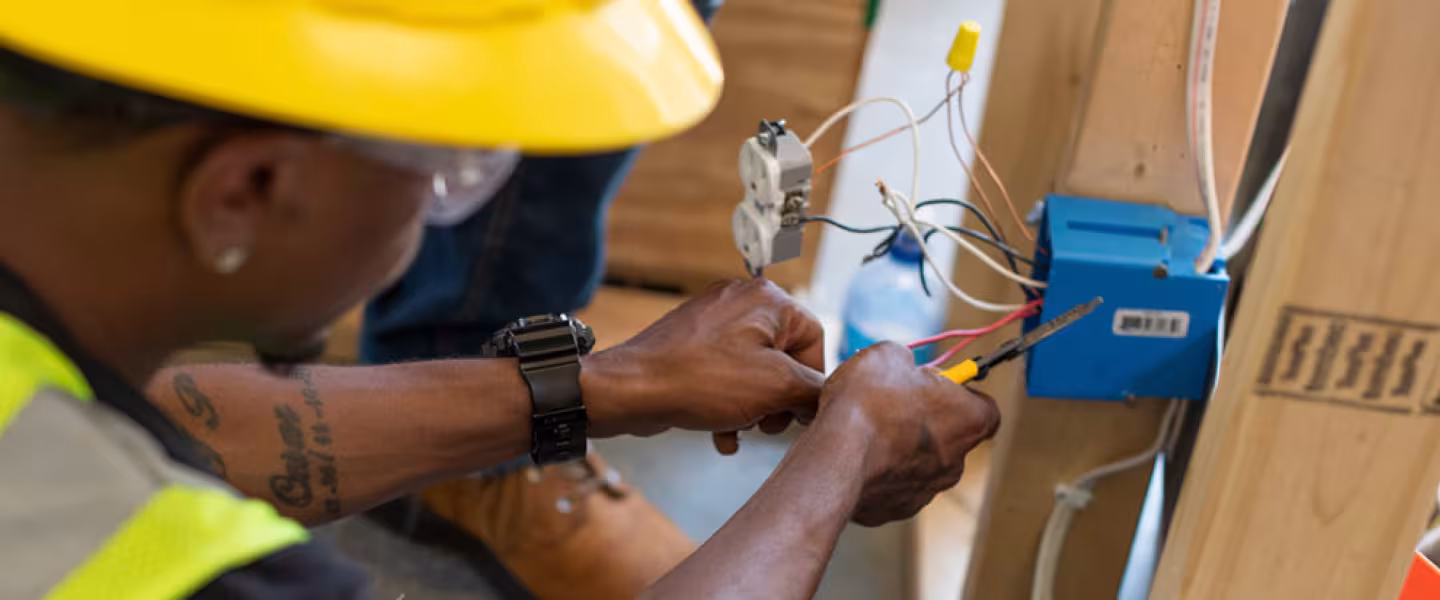 Electrician student wiring an outlet