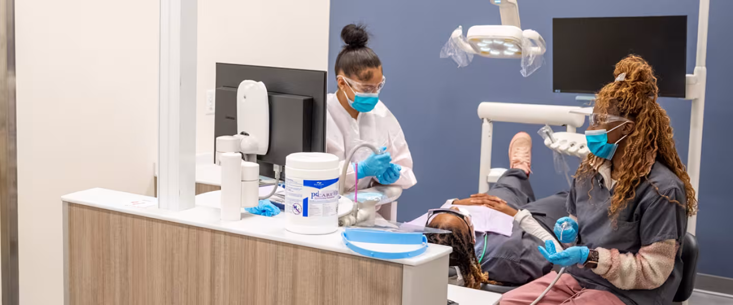dental assistant students in exam rooms learning hands on