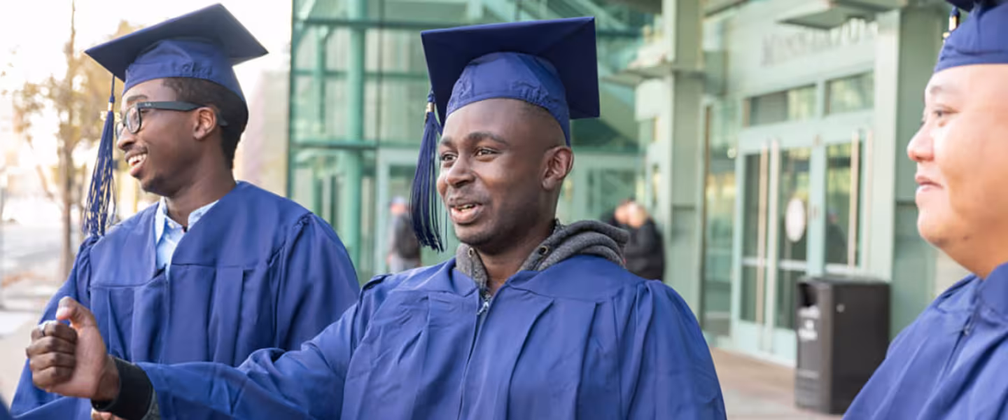 Summit students wearing caps and gowns after commencement