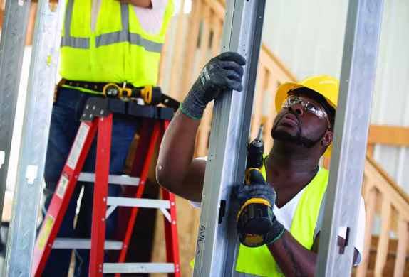 Summit carpentry student working on framing