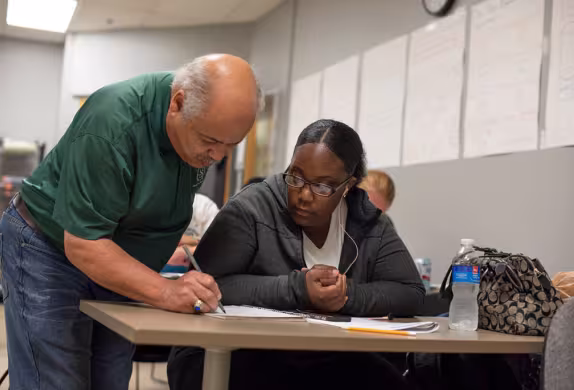 Instructor and student working together