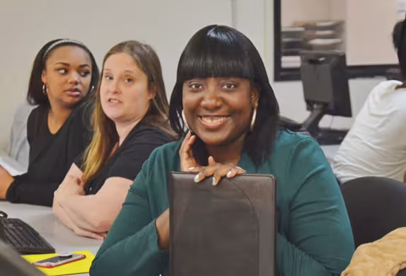 female student at desk in classroom