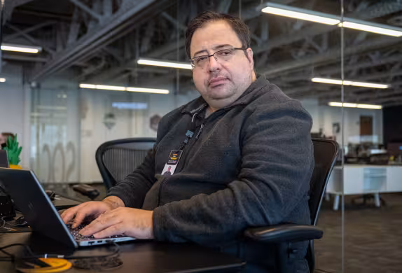 Photo of Summit Academy IT grad, Hristo, working at Atomic Data