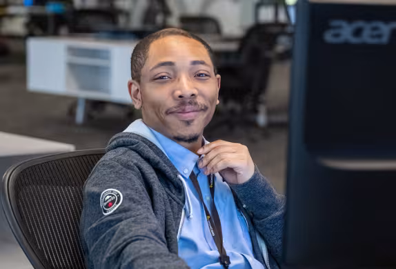 Photo of Shamarrez, Summit IT graduate and Atomic Data employee