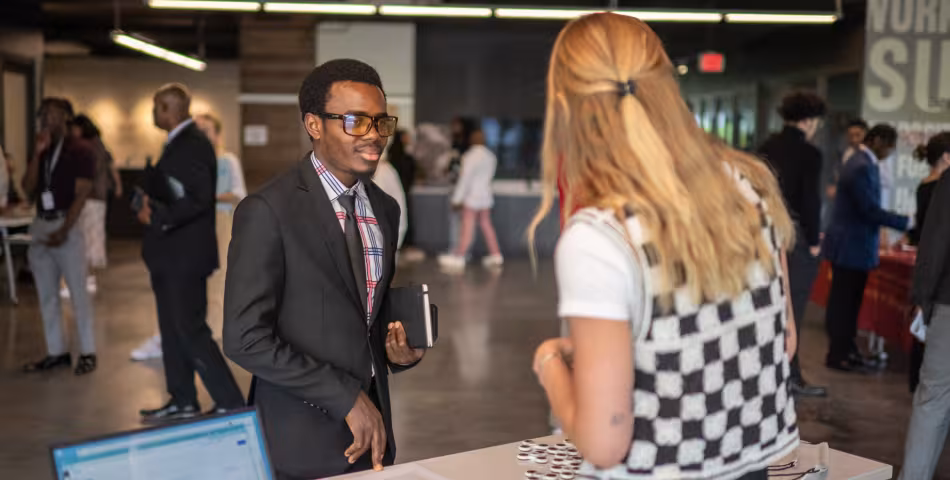 Student and employer talking at Summit's hiring fair event