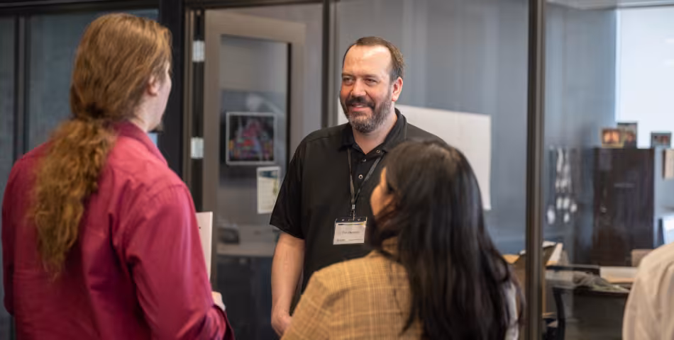 Summit student talking to an employer from Atomic Data at Summit's hiring fair event