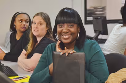 female student at desk in classroom