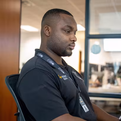 Photo of Summit alum, Domi, working at Atomic Data