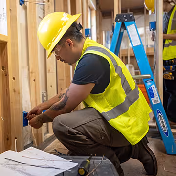 Electrician student wiring an outlet