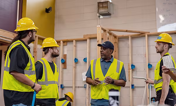 Electrician students with instructor in classroom