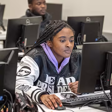 student in financial services classroom