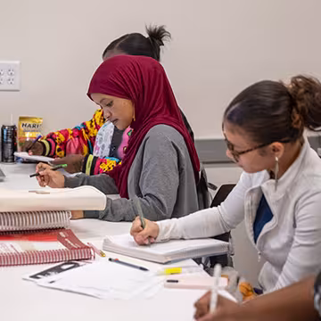 Medical Administrative Assistant students taking notes in classroom