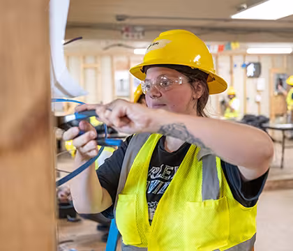 Electrician student at Summit learning wiring hands-on