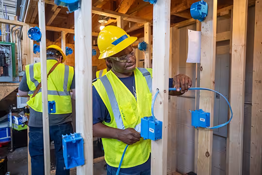 Electrician student at Summit learning wiring hands-on