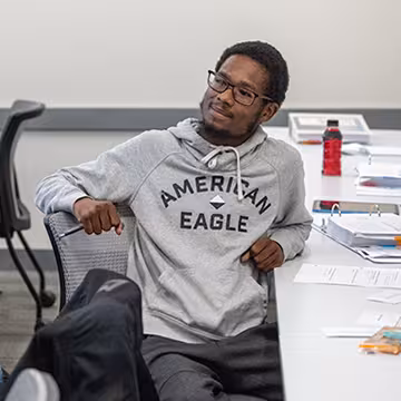 GED student listening to the instructor in class at Summit Academy