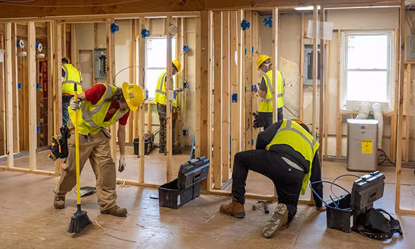 Electrician students learning hands on in classroom