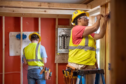 Electrician students learning wiring