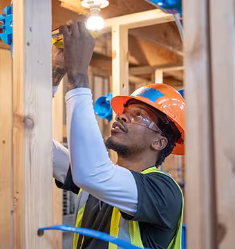 Electrician student learning wiring hands on