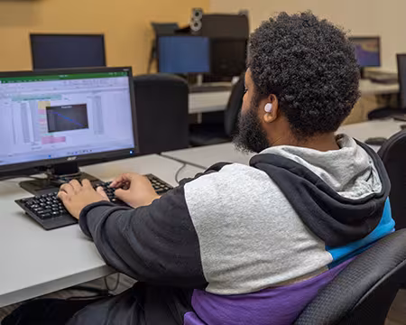 student in financial services classroom