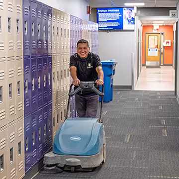 smiling custodian working at Summit Academy