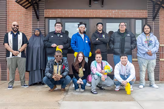 Group of GED students outside Summit Academy after a celebration