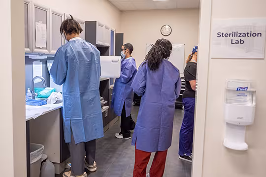 Unlicensed Dental Assistant students and instructors in the sterilization lab
